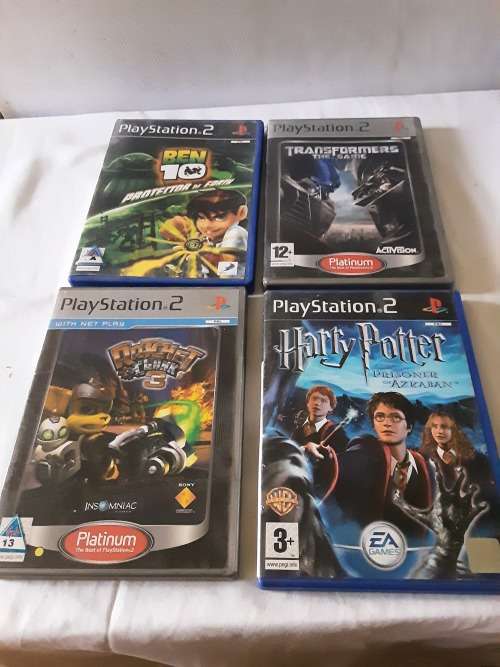 PS2 CONSOLE INCL.POWER SUPPLY, 2 REMOTES AND 13 GAME DISCS