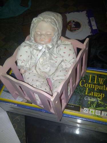 VINTAGE WIND-UP DOLL IN WOODEN COT-see description