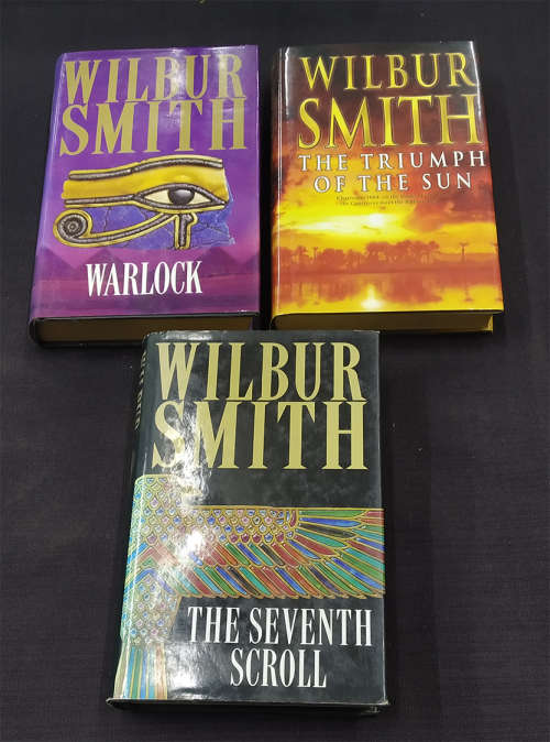 Trio of Wilbur Smith Books with Dust Jackets-Warlock, Triumph of the Sun and Seventh Scroll