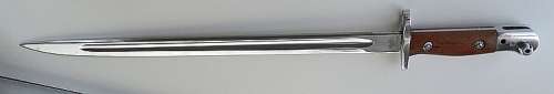 PARADE BAYONET WITH ORIGINAL SCABBARD  WITH SEVERAL MARKINGS VERY GOOD CONDITION