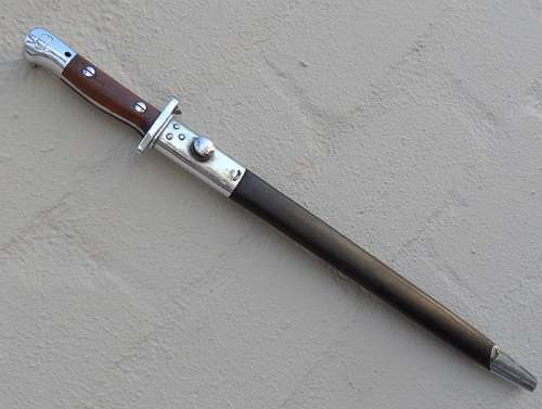 PARADE BAYONET WITH ORIGINAL SCABBARD  WITH SEVERAL MARKINGS VERY GOOD CONDITION