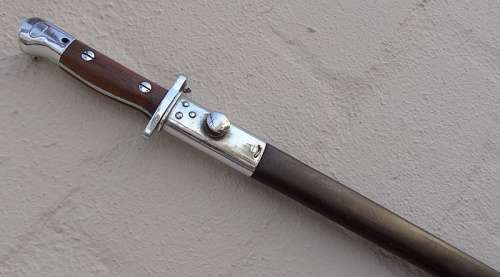 PARADE BAYONET WITH ORIGINAL SCABBARD  WITH SEVERAL MARKINGS VERY GOOD CONDITION