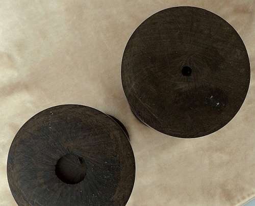 A PAIR OF HAND CARVED WOODEN CANDLE HOLDERS