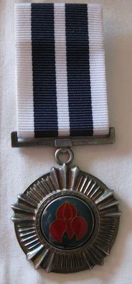 PRO MERITO MEDAL (1975) FULL SIZE NUMBERED 1810 WITH 1986 ISSUE RIBBON