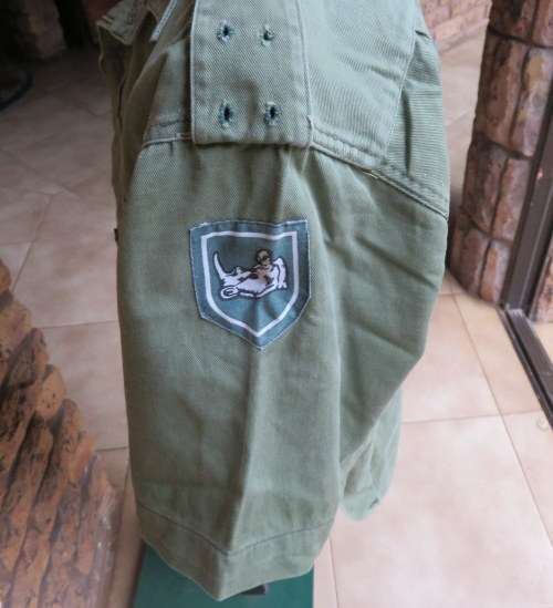 RHODESIAN OLIVE GREEN,SHORT SLEEVE SHIRT WITH 2X FORMATION SHOULDER PATCHES-SIZE MEDIUM-MEASURES  54