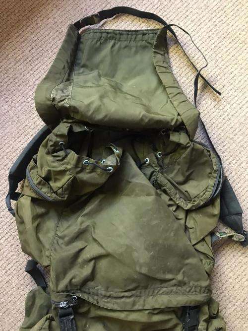 RECCE USED,OLIVE GREEN BACKPACK WITH NO METAL FRAME-ORIGINAL WITH SOME RECCE CAMO TAPE STILL ON IT