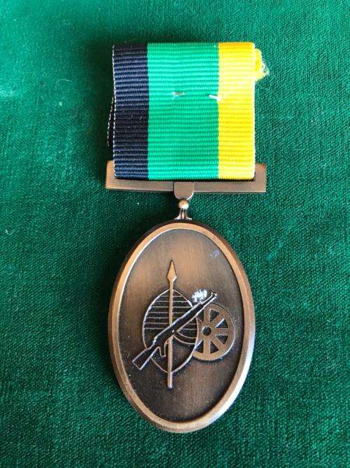 FULL SIZE SERVICE MEDAL IN BRONZE FOR YEARS SERVICE TO MK