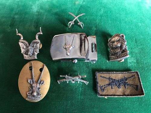 SELECTION OF 6 SWA BADGES AND ONE BELT BUCKLE-ONE OF THE BADGES A SCARCE PT INSTRUCTORS,OXIDISED SIL
