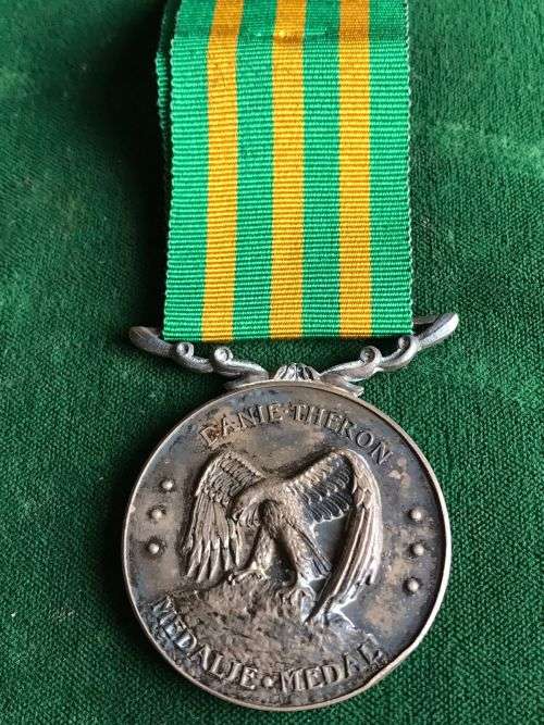 FULL SIZE SILVER DANIE THERON MEDAL (DTM)1970-1997-SA MINT AND SILVER MARKINGS ON THE BACK-NUMBERED