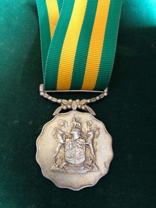 FULL SIZE GOOD SERVICE MEDAL NUMBERED 1534 ON RIM-GOLD-1975- 30 YEARS