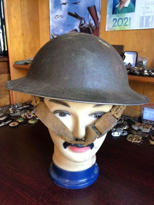 BRITISH STEEL HELMET WW2 WITH HOLES ON THE BACK RIM FOR SHADE FLAP-MADE IN SA AND USED IN NORTH AFRI