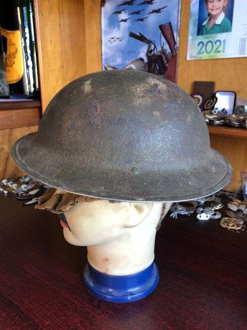 BRITISH STEEL HELMET WW2 WITH HOLES ON THE BACK RIM FOR SHADE FLAP-MADE IN SA AND USED IN NORTH AFRI