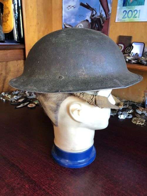 BRITISH STEEL HELMET WW2 WITH HOLES ON THE BACK RIM FOR SHADE FLAP-MADE IN SA AND USED IN NORTH AFRI