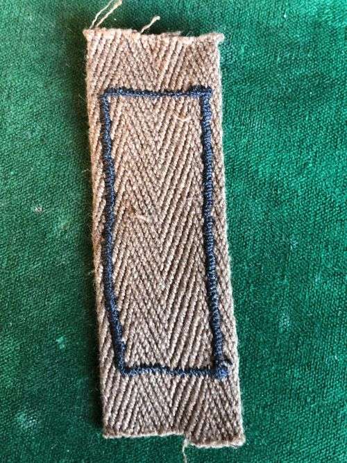 SADF PERIOD MARKSMAN BADGE PRINTED ON NUTRIA WITH EMBROIDERED BORDER AROUND RIFLE