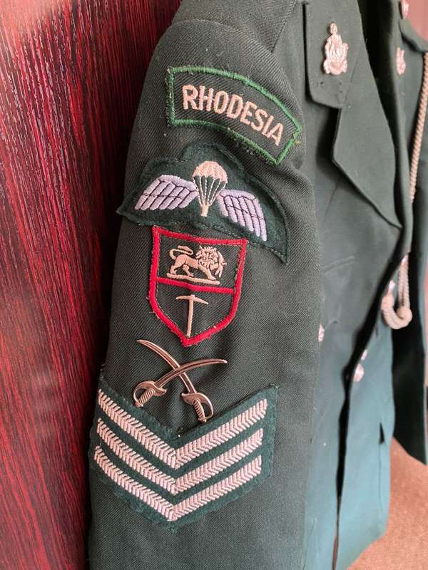 RHODESIAN GREENS,COMPLETE WITH TROUSERS,SAM BROWN AND PARADE RLI GLOVES-IT BELONGED TO DES JORDAAN-