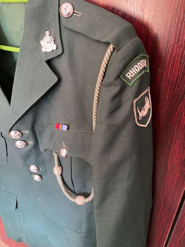 RHODESIAN GREENS,COMPLETE WITH TROUSERS,SAM BROWN AND PARADE RLI GLOVES-IT BELONGED TO DES JORDAAN-