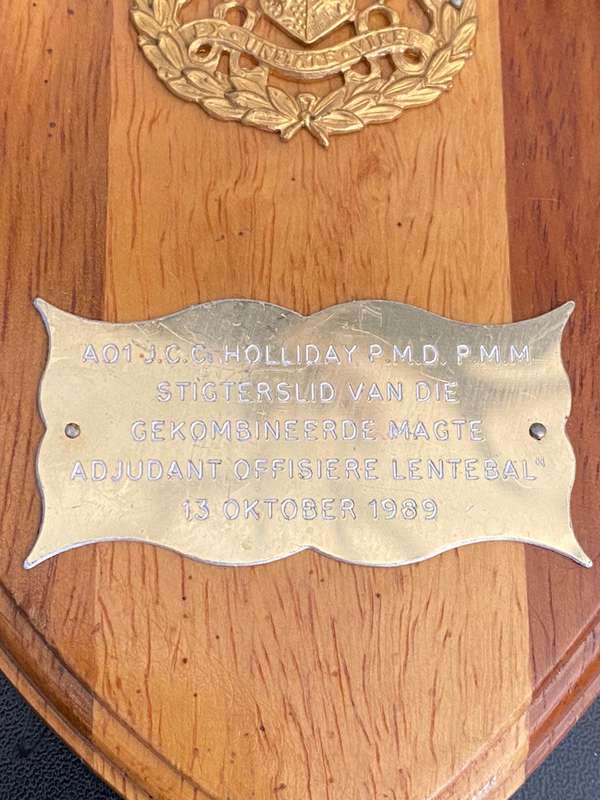 A PLAQUE TO AO1 J.C.C. HOLLIDAY P.M.D. P.M.M.