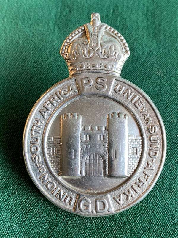 UNION OF SOUTH AFRICA PRISONS SERVICES,HELMET AND CAP BADGE-MEASURES 65X45 MM-WHITE METAL