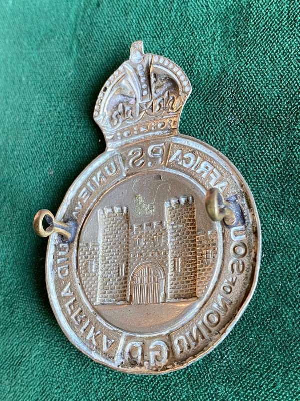 UNION OF SOUTH AFRICA PRISONS SERVICES,HELMET AND CAP BADGE-MEASURES 65X45 MM-WHITE METAL