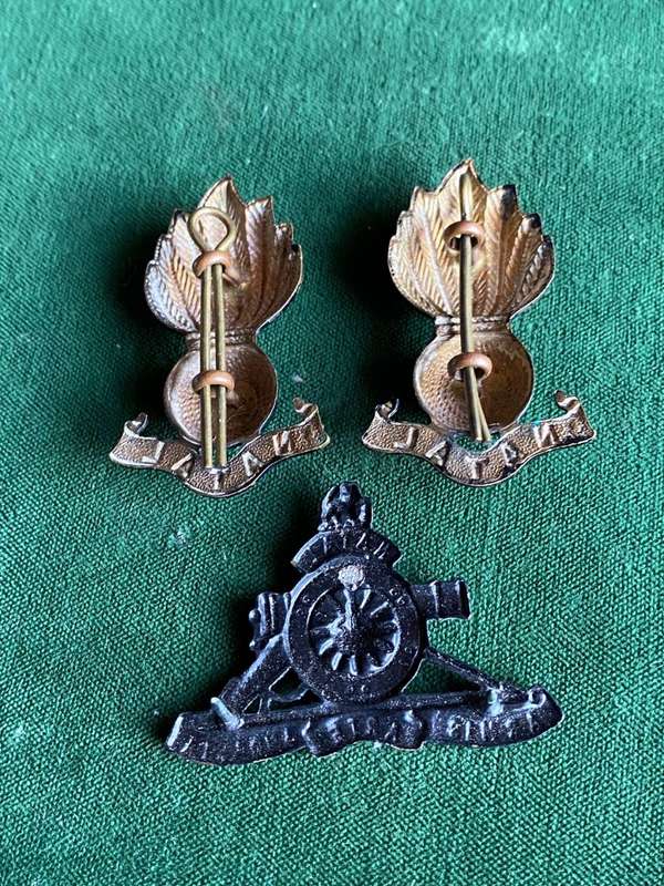 NATAL FIELD ARTILLERY BLACKENED BRONZE CAP BADGE AND COLLAR BADGES(ALSO LATER WORN AS CAP BADGE)APPR