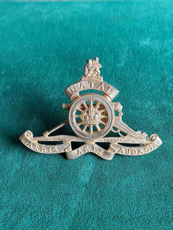 NATAL FIELD ARTILLERY CAP BADGE-ADOPTED IN 1967 GILDING METAL-WORN BY OTHER RANKS- 2 LUGS