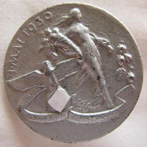 GERMAN - 1 MAY 1939 TINNY WITH MAKERS MARKINGS ON BACK.  STICK-PIN INTACT.