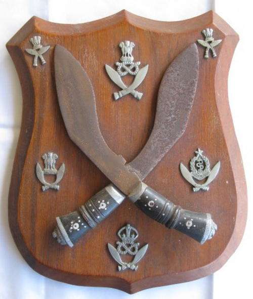 PLAQUE WITH ORIGINAL GHURKA BADGES.  MEASURING 27X22CM.