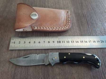 Handmade Damascus steel folding knife with BULL Horn handle scales