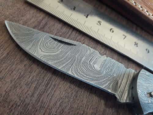 Handmade Damascus steel folding knife with BULL Horn handle scales