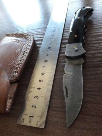 Handmade Damascus steel folding knife with BULL Horn handle scales