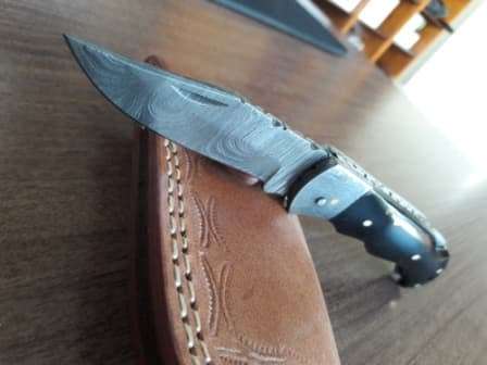 Handmade Damascus steel folding knife with BULL Horn handle scales