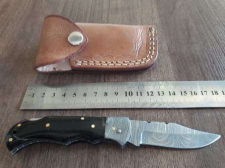 Handmade Damascus steel folding knife with BULL Horn handle scales
