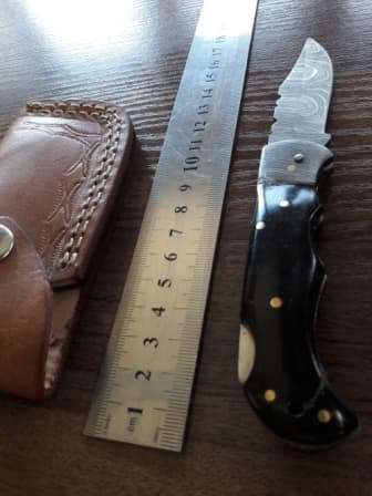 Handmade Damascus steel folding knife with BULL Horn handle scales