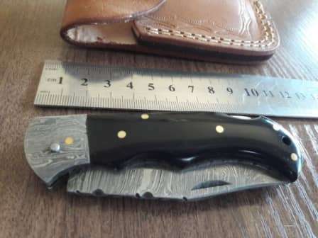 Handmade Damascus steel folding knife with BULL Horn handle scales