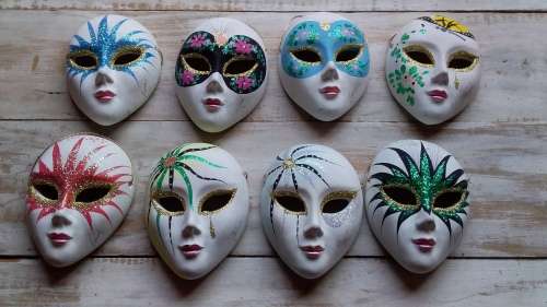 Eight Ceramic Paint & Glitter Wall Hanging Masks for One Bid