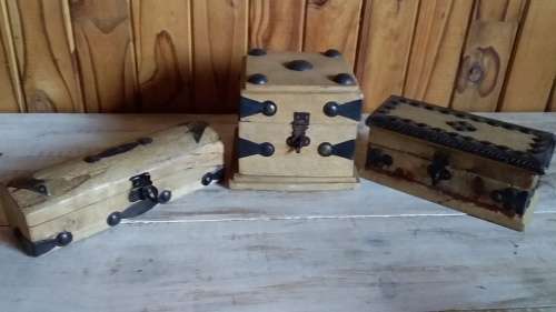 Three Carved Wooden Boxes with Metal Attachments