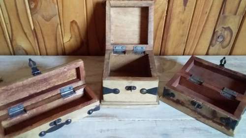 Three Carved Wooden Boxes with Metal Attachments