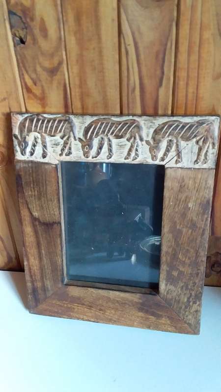 Thick Exotic Eood Frame with Carved Animals