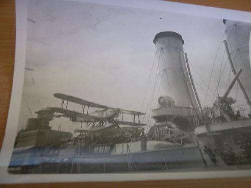 Close Up Photograph of Airplane on Ship's Deck