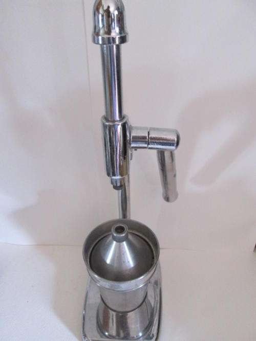 Large Chrome Juice Extractor that Needs Slight Attention