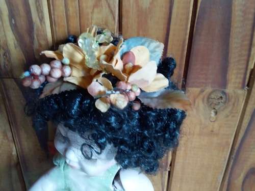 Ceramic doll with closed eyes