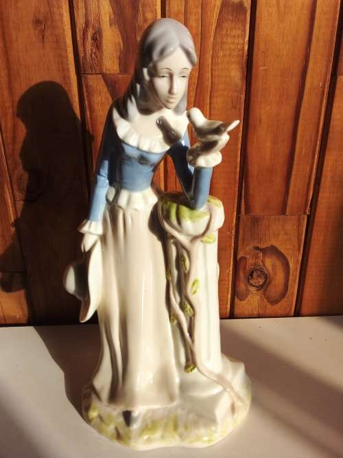 Lady with Bird Glazed Porcelain Figurine