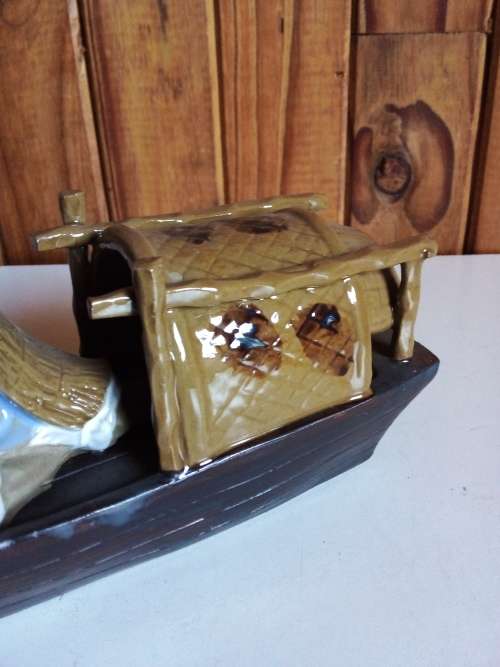 Vintage Partially Glazed Clay Oriental Fisherman in Boat