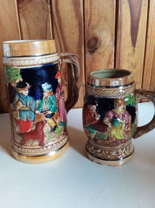 Two Tankards with Raised Detail for One Bid