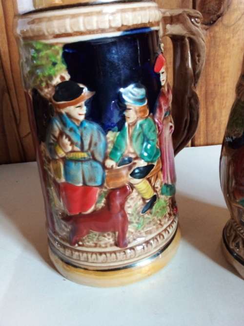 Two Tankards with Raised Detail for One Bid