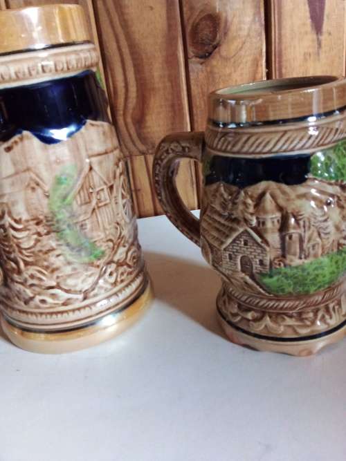Two Tankards with Raised Detail for One Bid