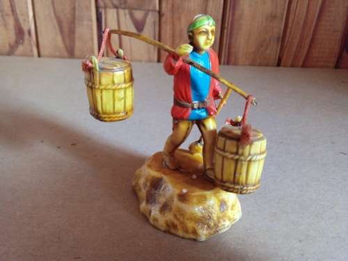 Small Basket Carrying Oriental Figurine
