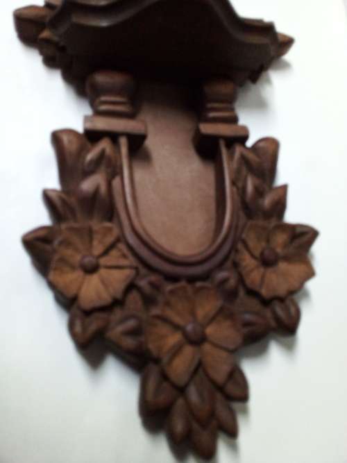 Decorative Carved Wooden Wall Hanging with Small Shelf