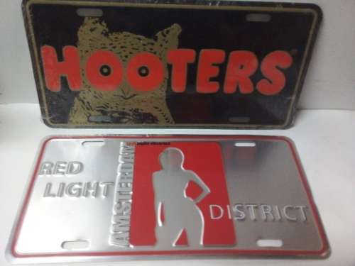 Two Light Metal Signs