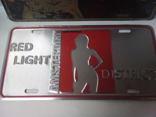 Two Light Metal Signs